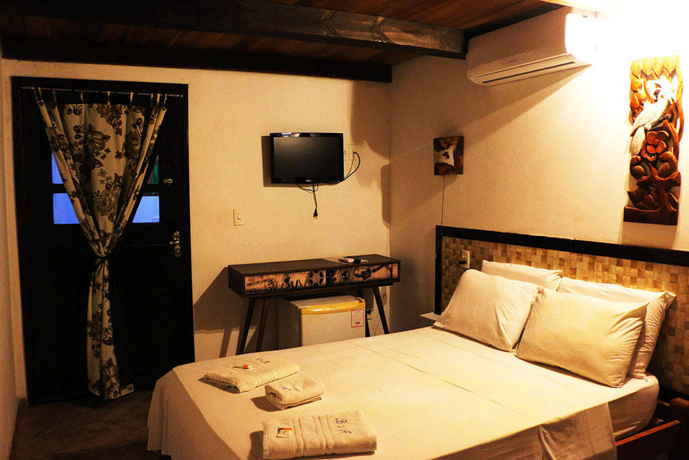 Quarto triplo com vista mar